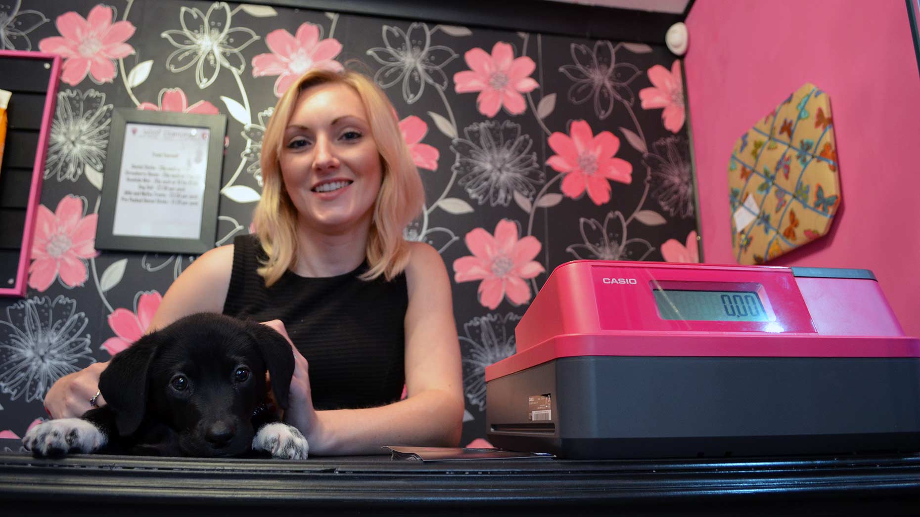 Suzie Barkworth, boutique owner with puppy Dempsey.