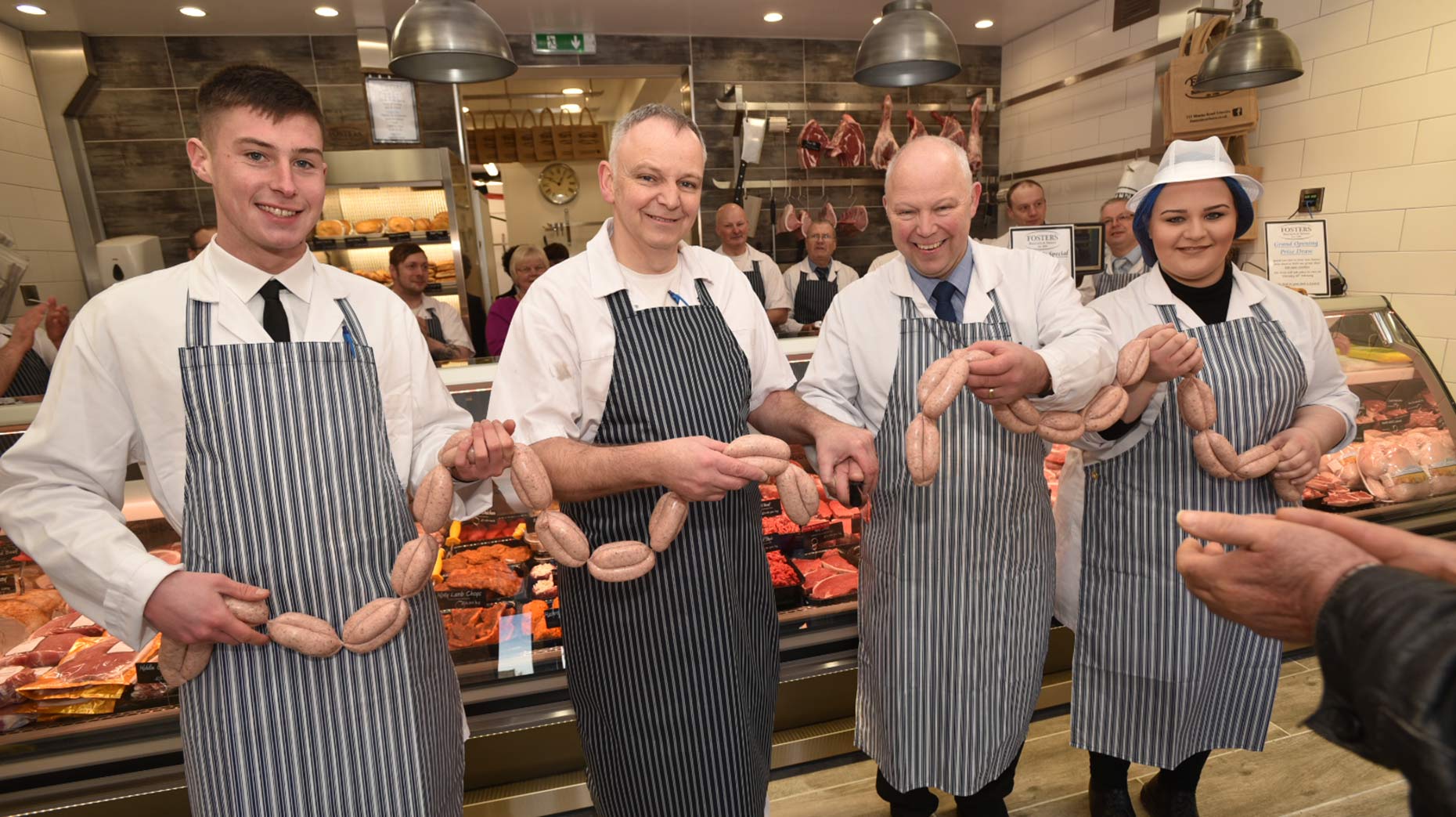 Staff at Fosters Butchers and Bakers celebrating the reopening of the shop. Photo: Steve Smailes for The Lincolnite