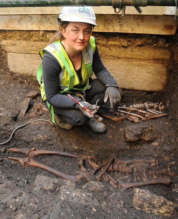 Archaeologist Cecily Spall from FAS Heritage uncovers one of the skeletons.