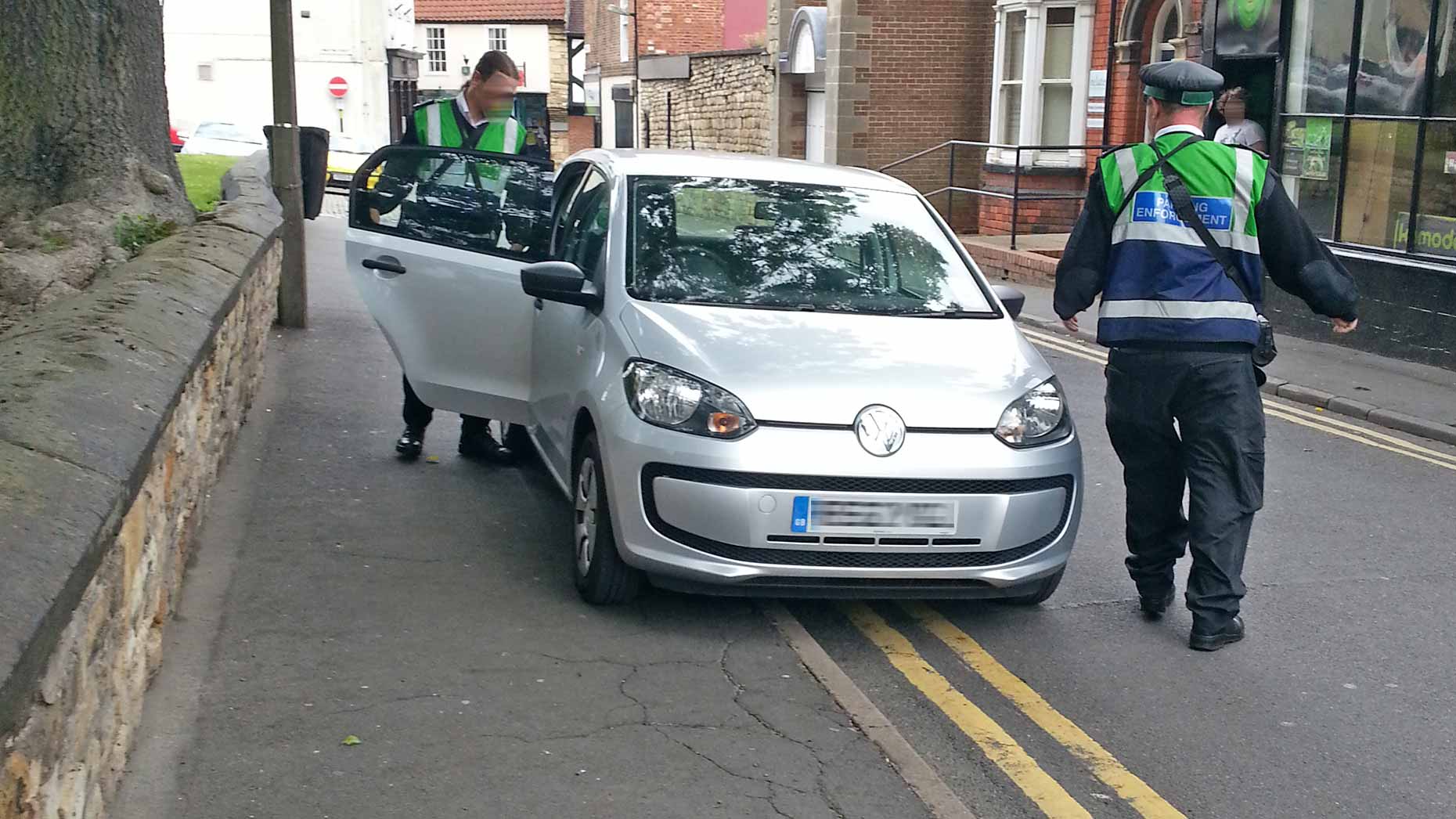Traffic wardens captured parking on double yellow lines on St Martin's Lane in Lincoln to ticket motorists. The council said they are allowed to do so on the job. Photo: Andy Ferguson