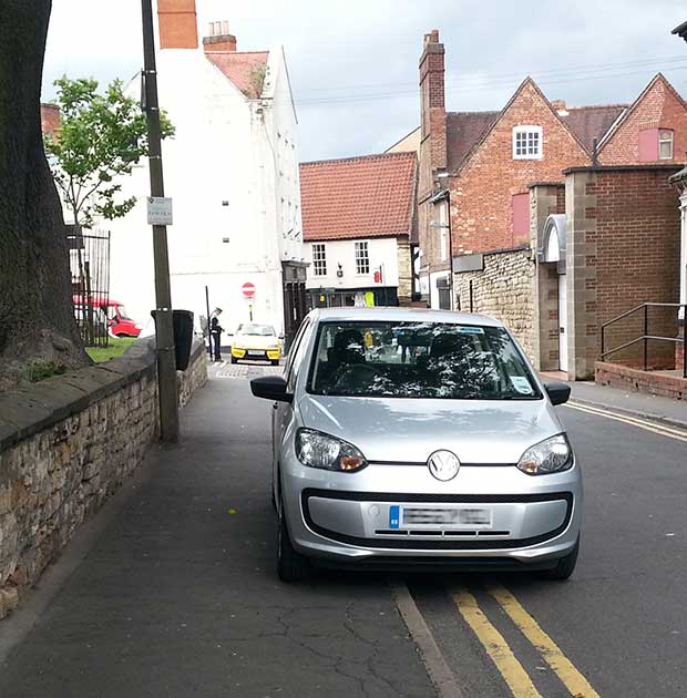 The parking wardens got out of their car for around 10 minutes to ticket two other vehicles parked illegally. Photo: Andy Ferguson