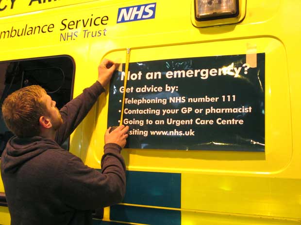 The correct use of the 999 number is highlighted on local ambulances.