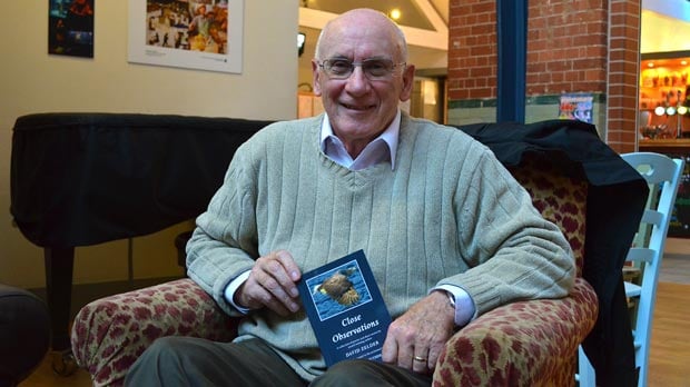 David Zelder with his new book Close Observations. Photo: Emily Norton for The LIncolnite