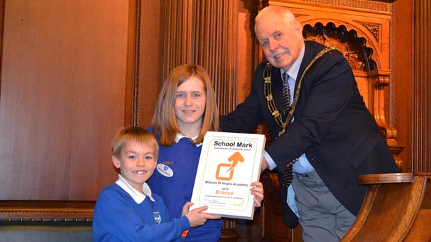 Witham St Hughs Academy collecting their award from Cllr Patrick Vaughan, Mayor of Lincoln.
