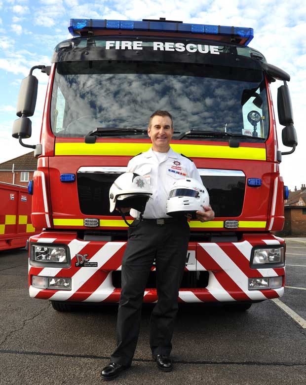 Mike is looking forward to swapping his uniform for his racing helmet. Photo: Yellow Story