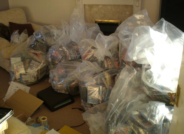 The fake DVDs in the man's living room. Photo: Lincolnshire Trading Standards