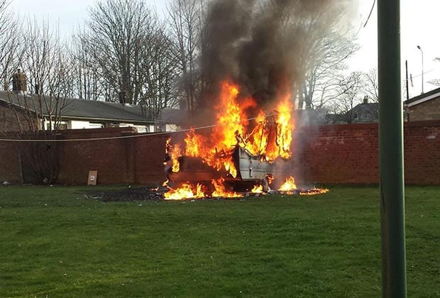 The caravan on fire in the green space on Browning Drive in Lincoln. Photo: Nigel Mulhall