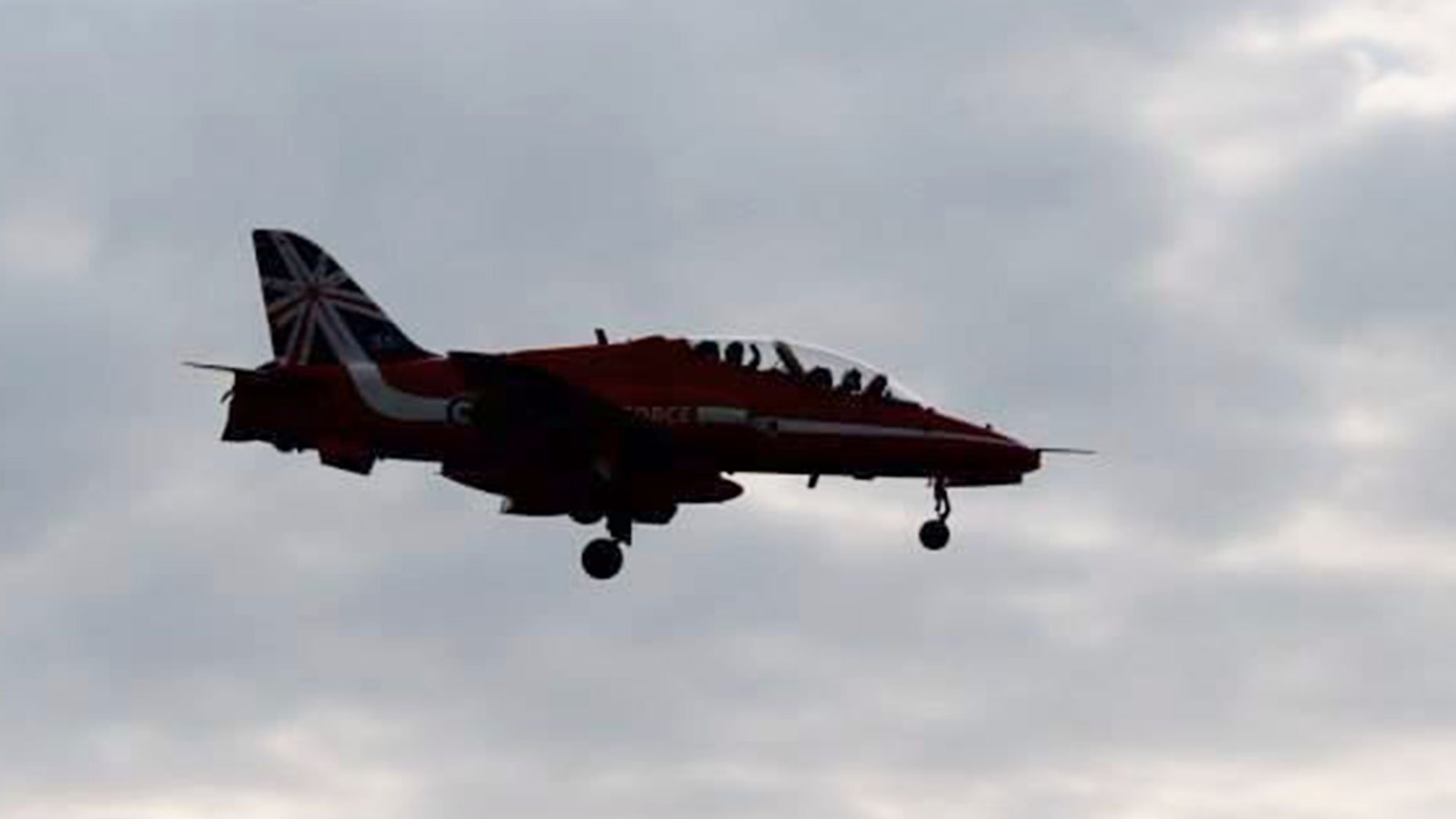 Red Arrows pilot waves as the team fly over Lincoln on May 31, 2014. Photo: Joanne Guest