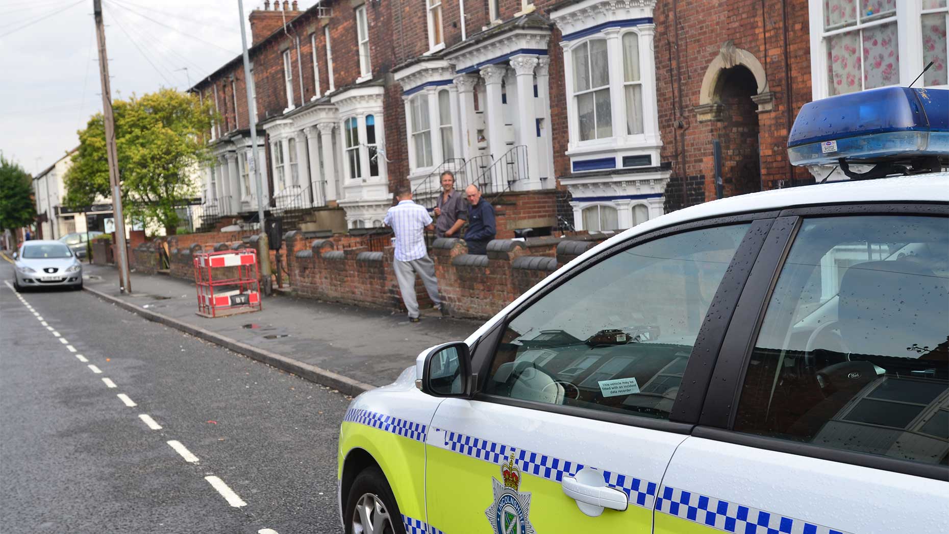 Police at the scene of the incident on Portland Street. 