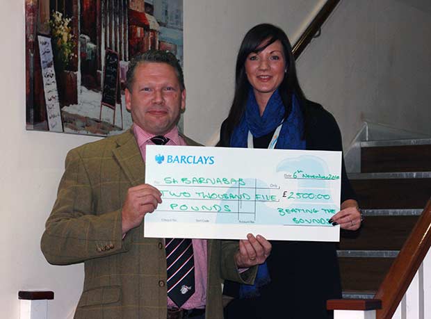 Karl hands over cheque to St Barnabas Hospice Lincolnshire.