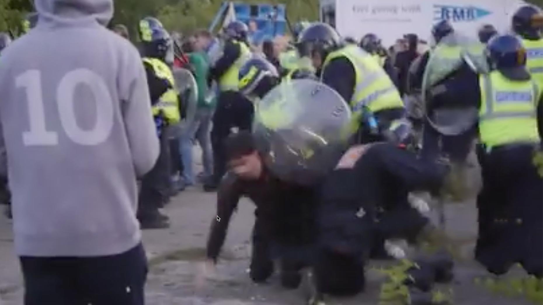 Throughout the night, the police are shown trying to push back the line of people at the illegal rave, with continued taunts and bottles thrown from the crowd. Screenshot: Chris Shaw
