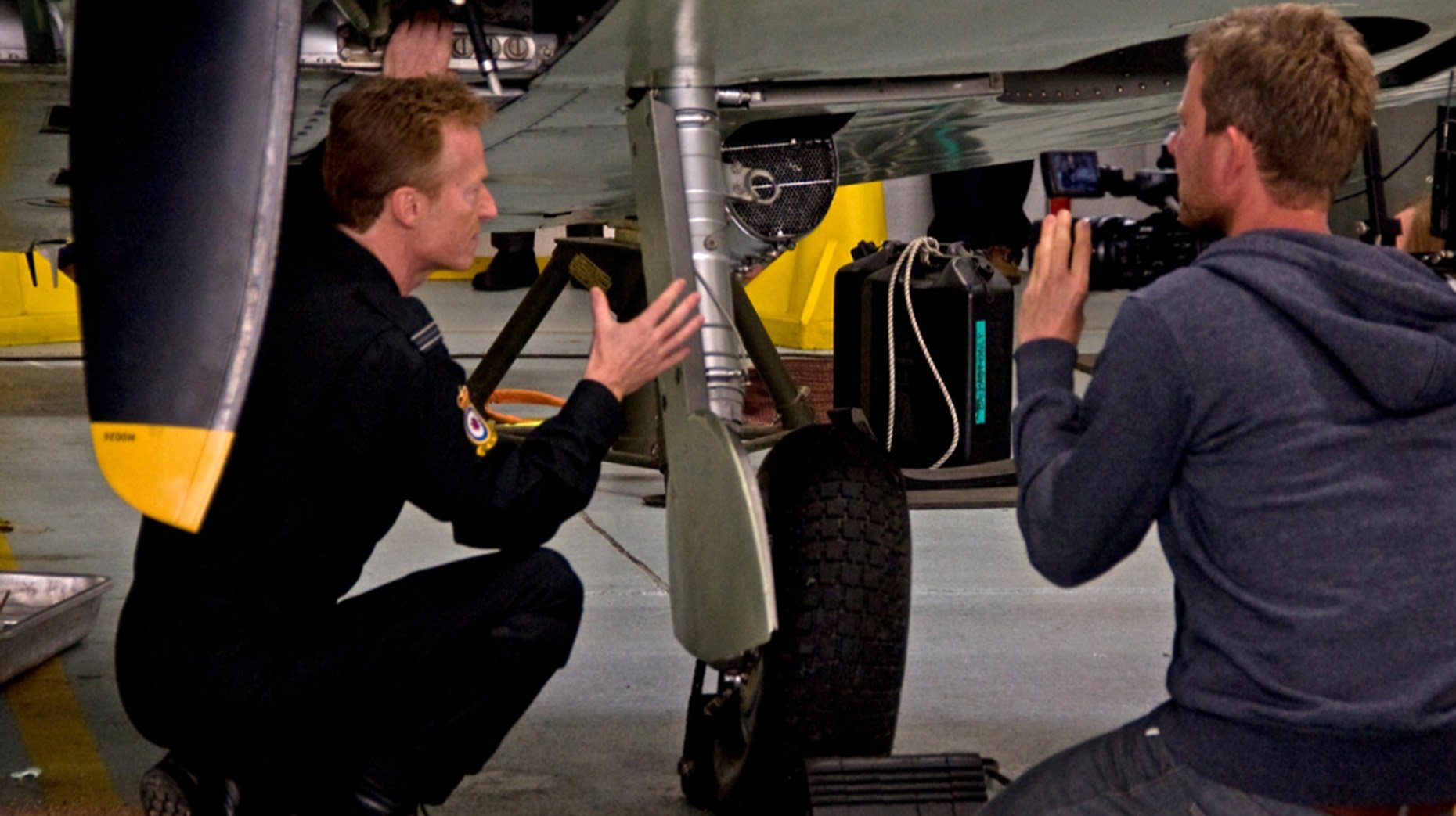 Flight Lieutenant Antony Parkinson of the Battle of Britain Memorial Flight, being filmed by a camera crew at RAF Coningsby, Lincolnshire, for a new BBC documentary series. Photo: MoD/Crown Copyright 2015 