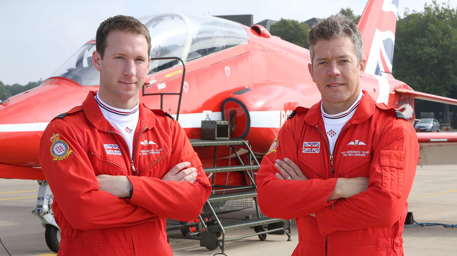 Flight Lieutenant Si Taylor (left) and Flight Lieutenant Matt Masters (right), who are joining the Royal Air Force Aerobatic Team as display pilots for the 2016 season, stand in front of a Red Arrows Hawk jet. Picture by Corporal Steve Buckley – MoD/Crown Copyright 2015. 