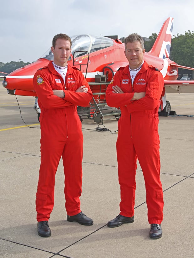 Flight Lieutenant Si Taylor (left) and Flight Lieutenant Matt Masters (right), who are joining the Royal Air Force Aerobatic Team as display pilots for the 2016 season, stand in front of a Red Arrows Hawk jet. Picture by Corporal Steve Buckley – MoD/Crown Copyright 2015.