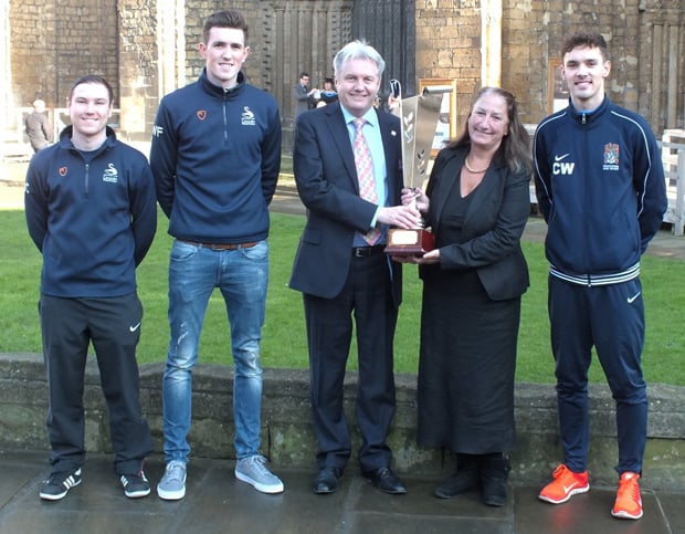 BGU's Vice Chancellor, the Rev Canon Professor Peter Neil, and University of Lincoln Vice Chancellor Professor Mary Stuart with the Cathedral Cup. Also pictured (left to right) are Matt Cunliffe and Will Fry from the University of Lincoln and Callum Ward from BGU.