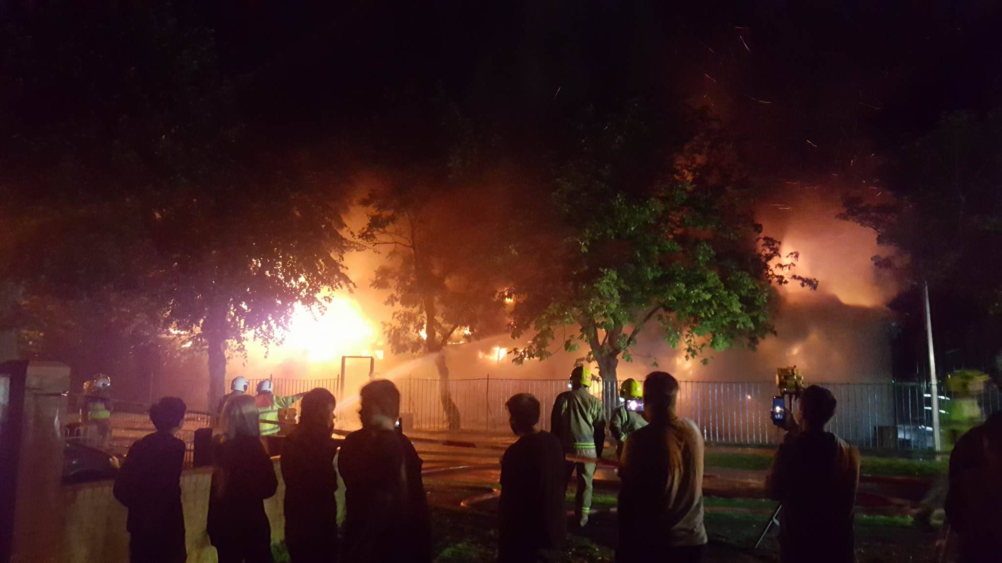 By 11.30pm the building had collapsed and surrounding trees had begun to catch alight. Photo: Zoe Clarke