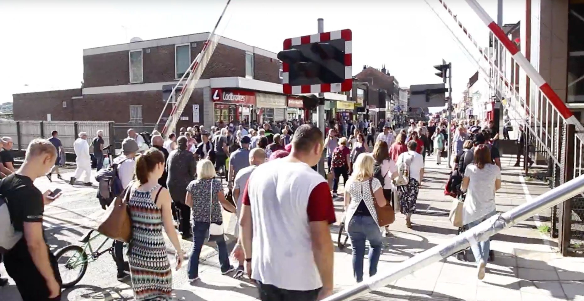 Swarms of people were filmed waiting at the crossing, rather than using the new £12 million bridge.